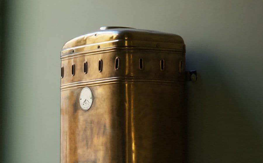 Hot water storage tank mounted on a wall